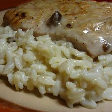 chicken and rice with gravy on a plate