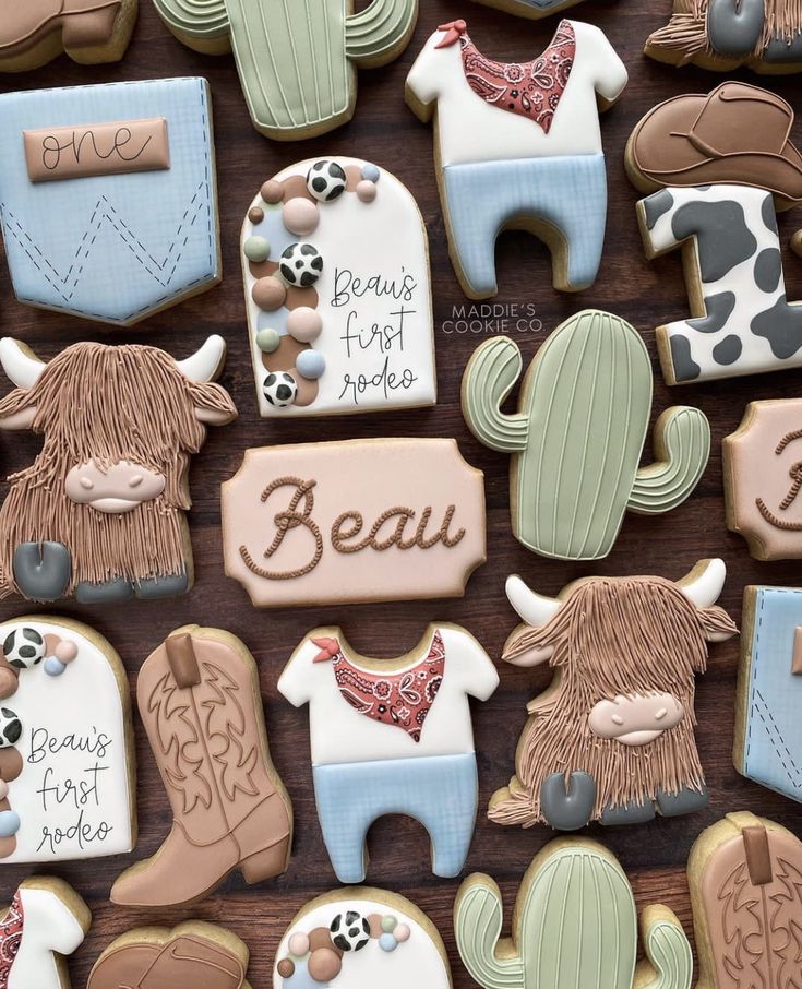 decorated cookies are arranged in the shape of horses, cowgirls and cowboy boots