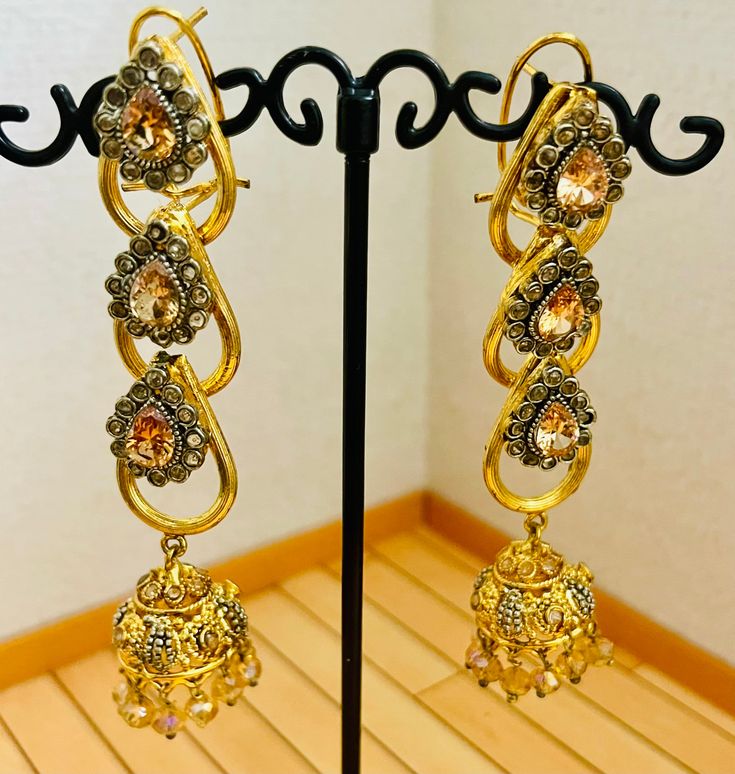 Beautiful bollywood indian pakistani gold pleated earring  Please keep in mind that the colour of the product shown in the pictures may vary from the original due to the lighting used. Bollywood Style Silver Jhumkas For Reception, Glamorous Gold Plated Earrings For Weddings, Elegant Pearl Drop Danglers For Reception, Glamorous Gold Plated Wedding Earrings, Silver Bollywood Danglers For Reception, Bollywood Silver Danglers For Reception, Traditional Pearl Drop Earrings For Reception, Gold Pearl Drop Earrings For Reception, Silver Festive Earrings For Reception