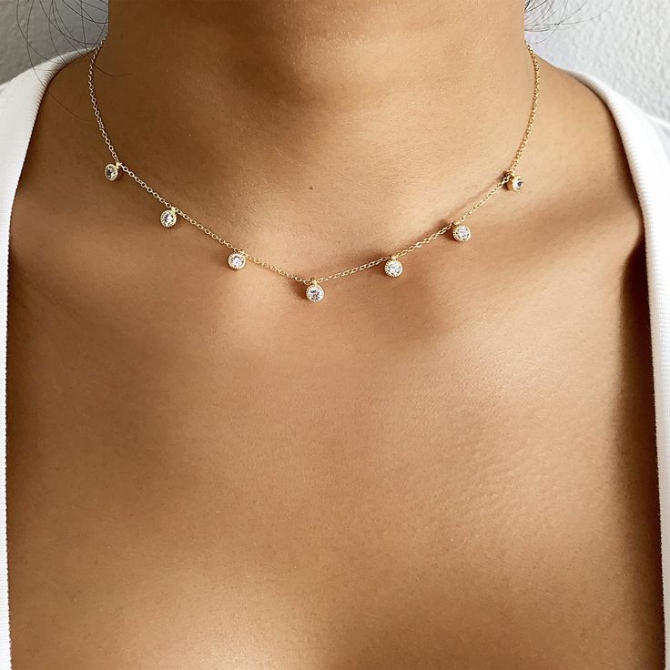 This delicate cubic zirconia dangle choker is perfect for layering with your favorite everyday pieces. Features eye-catching shiny circular cubic zirconia discs that dangle from a delicate chain. Available in sterling silver or 14kt gold filled. Length: 12" + 3" extender Diamond Circle Necklace, Diamond Choker Necklace, Diamond Choker, Diamond Solitaire Necklace, Solitaire Necklaces, Gold Choker Necklace, Bezel Set Diamond, Gold Choker, Jewelry Choker