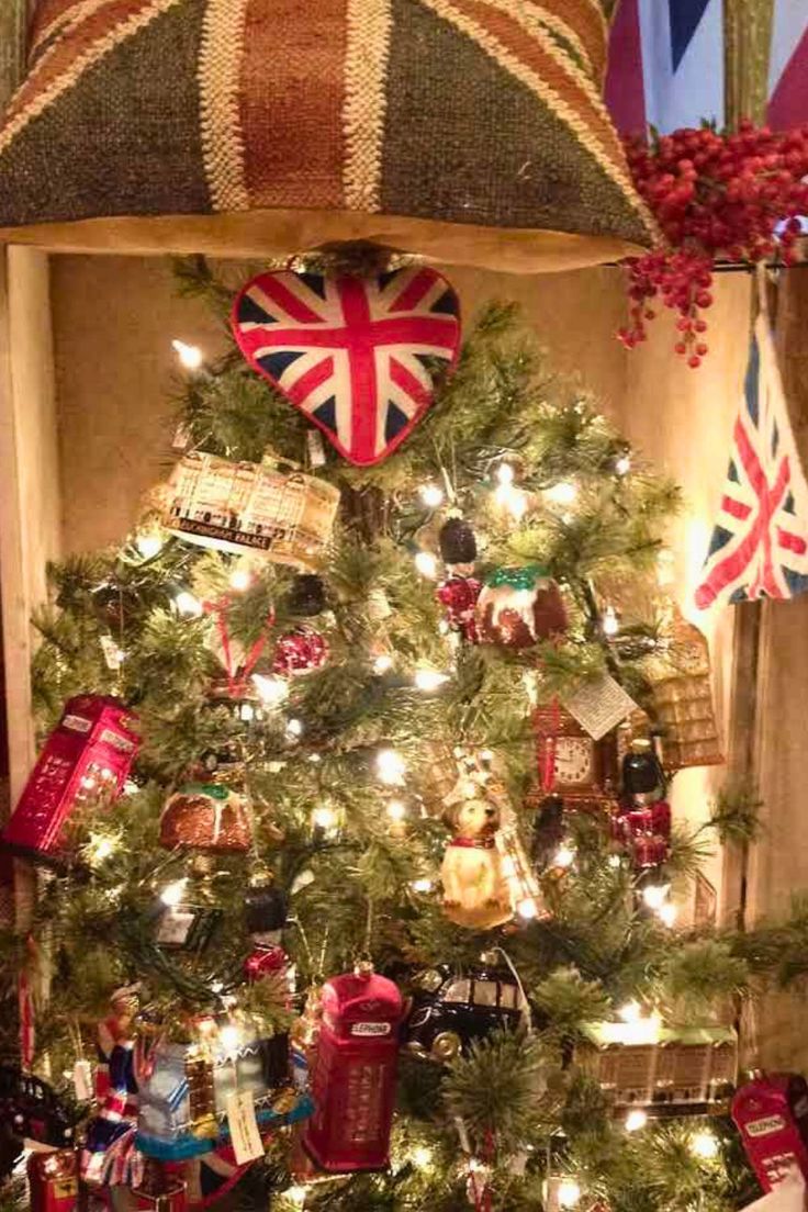 a christmas tree decorated with british flags and gifts