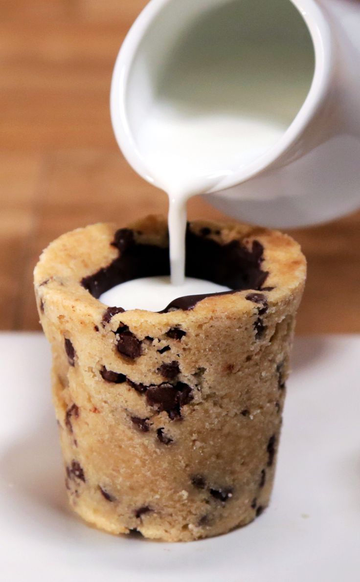 chocolate chip cookie cupcake being poured with milk