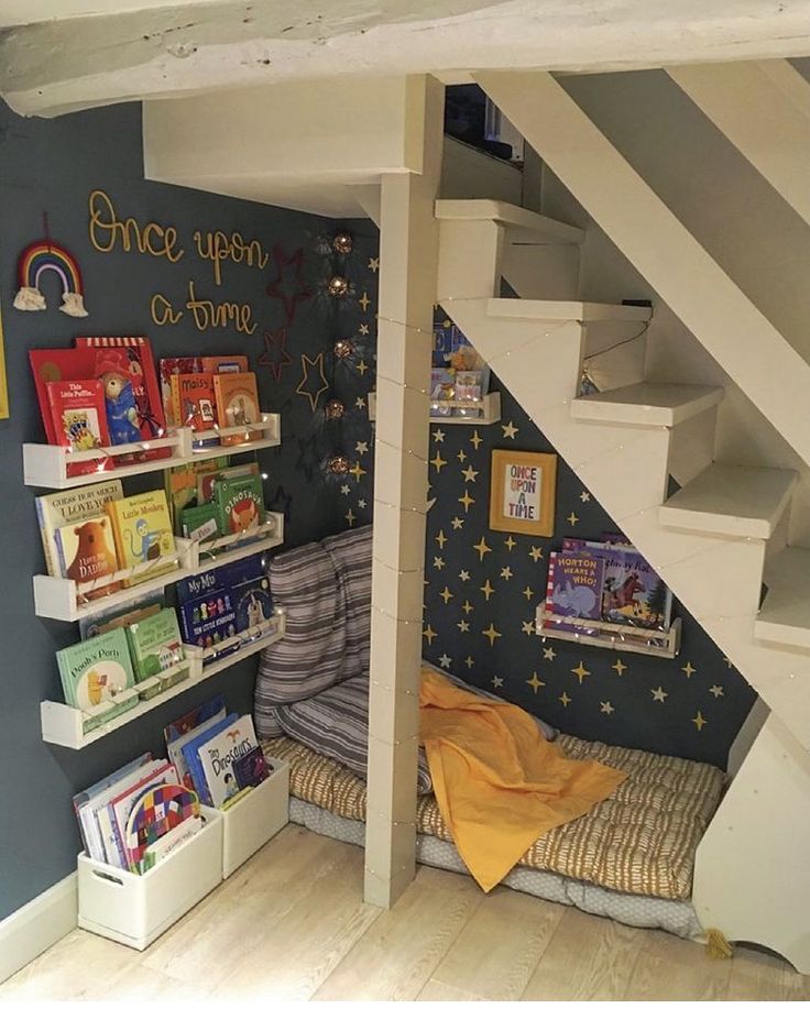 a child's room with bookshelves and stairs