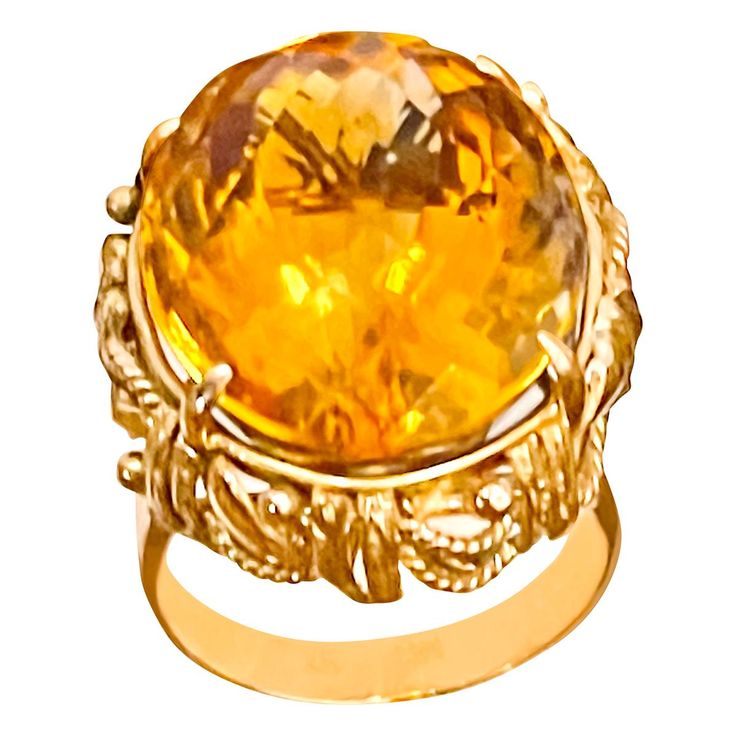 Approximately 20 Carat Natural Oval Citrine Cocktail Ring in 14 Karat Yellow Gold, Estate This is a ring which has a approximately 20 carat of high quality Citrine stone. The stone is 21X17 MM Color and clarity is very nice. No diamonds , no bling , just simple and solid make 14 K Yellow gold 11.8 grams with stone Ring size 6.5 and can be altered to any size Very nice vintage , gold design around the stone. Its very hard to capture the true color and luster of the stone, I have tried to add pict Luxury Yellow Oval Sapphire Ring, Elegant Yellow Oval Sapphire Ring, Luxury Oval Yellow Gold Topaz Ring, Luxury Yellow Gold Oval Topaz Ring, Luxury Gold Oval Gemstones, Formal Oval Yellow Topaz Ring, Formal Yellow Oval Topaz Ring, Luxury Yellow Oval Rings, Formal Citrine Ring With Diamond Cut