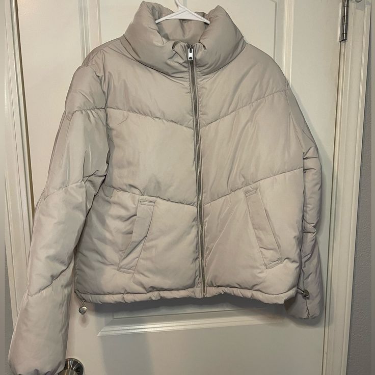 Brand New, Never Worn Cropped Puffer Jacket. No Flaws Or Issues. Very Warm And Comfortable. Color Is A Light Beige With Silver Zipper And Details To Cinch The Waist. Two Roomy Front Pockets. High Collar And Cinched Wrists To Keep You Warm. Love This Jacket, But Not My Style Anymore. Trendy Taupe Winter Outerwear, Trendy Taupe Outerwear For Winter, Trendy Beige Puffer Jacket For Spring, H&m Winter Outerwear In Neutral Color, H&m Winter Outerwear, H&m Outerwear For Cold Weather In Fall, H&m Beige Outerwear For Spring, Trendy Beige Puffer Outerwear, Trendy Long Sleeve Outerwear By H&m