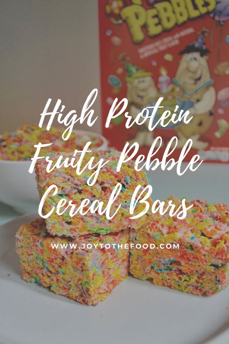 high protein fruity pebble cereal bars on a plate next to a box of cereal