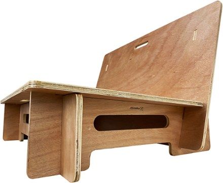 a wooden desk with a laptop on it's back and bottom shelf, made out of plywood