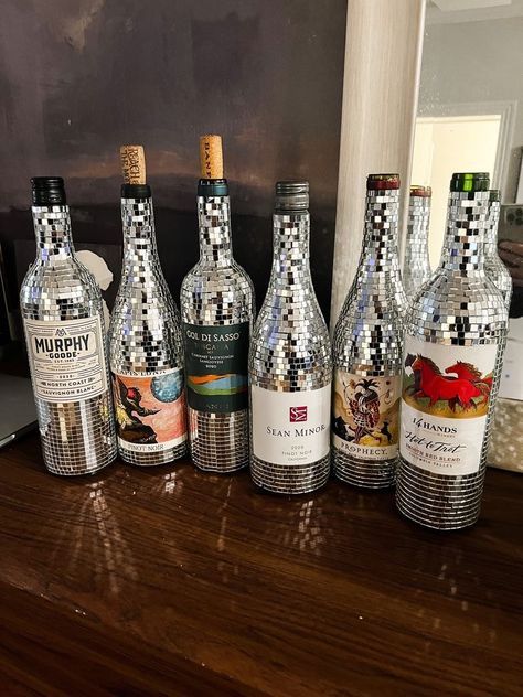 several bottles of alcohol are lined up on a table