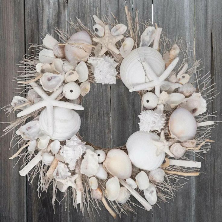 a wreath made out of seashells and seaweed