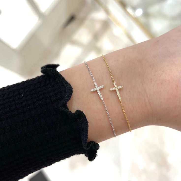 Our Esther Dainty Diamond Cross Bracelet is a glimmering beacon of faith. Stylish and elegant, this bracelet embodies the beauty of His grace. Perfect to shine on its own but sophisticated enough to add to a stack. The intentional delicacy of this design makes for the heartfelt gift of a child's first piece of fine jewelry or an adult's everyday dainty wear. Metal: 18k White Gold / 18k Yellow Gold / 18k Rose Gold Round Brilliant Cut Natural Diamonds: Approx. 0.10 ctw G Color and SI1-2 Clarity Diamonds Length: 7 inches at the longest. ﻿Adjustable sliding bead to provide options for smaller wrist size. Closure: Lobster clasp Measurements: Approx. 11.7mm length x 5.9mm width Looking for a different size? Please email us. Gold Bracelets With Pave Setting As Gift, White Diamond Bracelet With Pave Setting As Gift, White Gold Diamond Bracelet With Pave Setting For Gift, Elegant Chain Bracelet With Pave Setting As Gift, Elegant Pave Setting Chain Bracelet For Gift, Classic Chain Bracelet With Pave Setting As Gift, Elegant Sterling Silver Cross Rosary Bracelet, Timeless Tennis Bracelet With Pave Setting, Classic Pave Setting Chain Bracelet As Gift