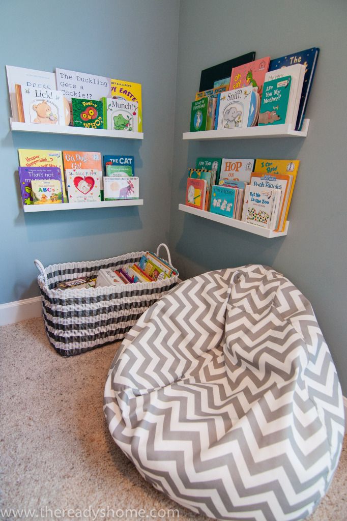 a child's reading nook with books on the shelves