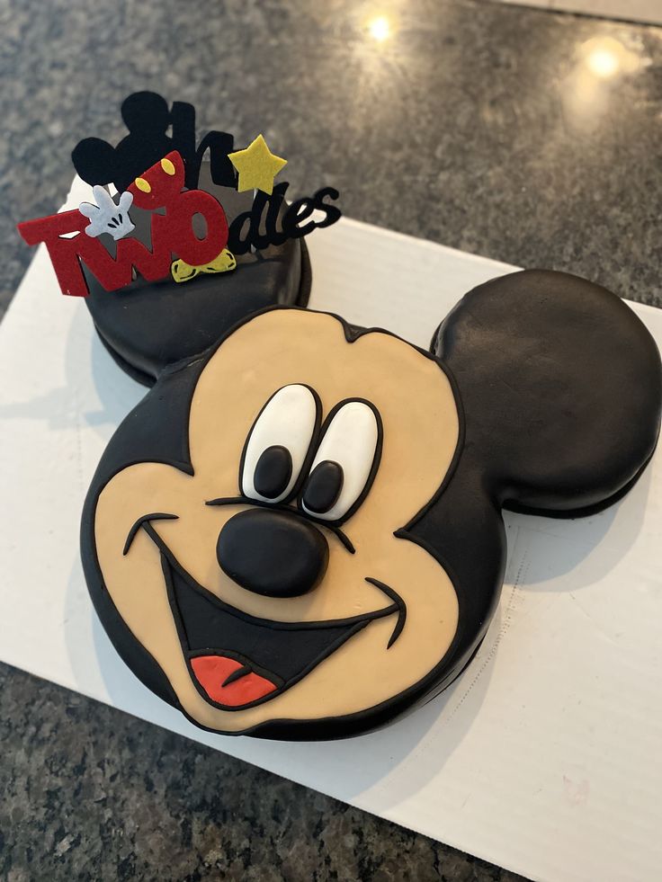 a mickey mouse cake on top of a table