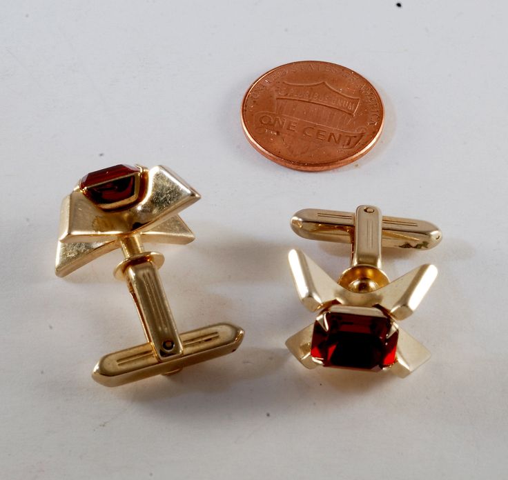 "Vintage HICKOK Cuff Links Red Glass Gem Gold Plated Brass Men's Cufflinks Signed USA GREAT PAIR OF VINTAGE MEN'S CUFF LINKS VERY RARE! THE CUFFS ARE SIGNED \"HICKOK USA.\" THESE CUFF LINKS ARE IN NICE USED CONDITION CIRCA 1960'S HAS WEAR TO THE FINISH AND WILL NEED SOME CLEANING AND POLISHING. NICE VINTAGE COLLECTIBLE CUFF LINKS PAIR. MEASUREMENTS: CUFFS 3/4\" X 5/8\"" Classic Red Cufflinks For Formal Occasions, Mens Cuff, Glass Gems, Cufflinks Men, Filigree Ring, Purple Glass, Favorite Rings, Cuff Links, Red Glass