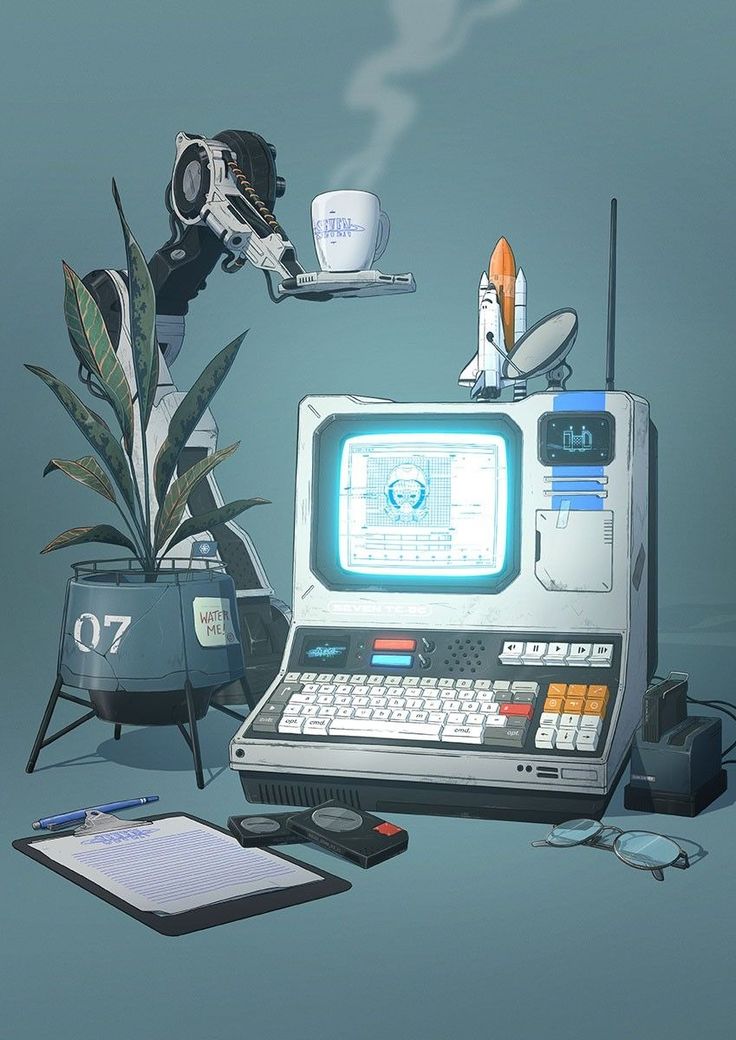 an old computer sitting on top of a table next to a plant and other items