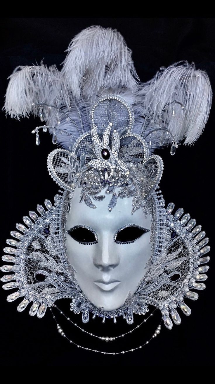 "Tudor Belle" is decked in a silvery cream, embroidered damask which has been fully hand-glitzed with Rhinestones and Swarovski elements and decorated with seed pearls, glass beads and ostrich feathers. Her ruff is made from antique silver lace with strings of glass beads and seed pearls suspended below it. Multi-coloured crystallised pendants hang from silver 'antlers' above and around her triple tiara.  Each Tiaura Arts piece comes with signed and dated certification detailing its unique title Venetian Masks Art, Elegant Masquerade Mask, Masquerade Decorations, Madi Gras, Jester Mask, Lion Couple, Midnight Masquerade, Venetian Masquerade Masks, Venetian Masquerade