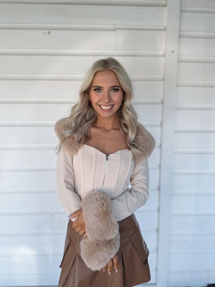 Stunning Fur trim beige crop top with corset like body and front zipper. Model is 5'4" with a 25" waist, 32" bust, and 32" hips wearing a small. Fall Beige Cropped Crop Top, Beige Cropped Crop Top For Fall, Beige Cropped Top For Fall, Beige Fitted Chic Corset, Chic Fitted Beige Corset, Chic Fitted Beige Crop Top, Cream Fitted Cropped Crop Top, Beige Fitted Chic Corset Belt, Chic Beige Corset Belt