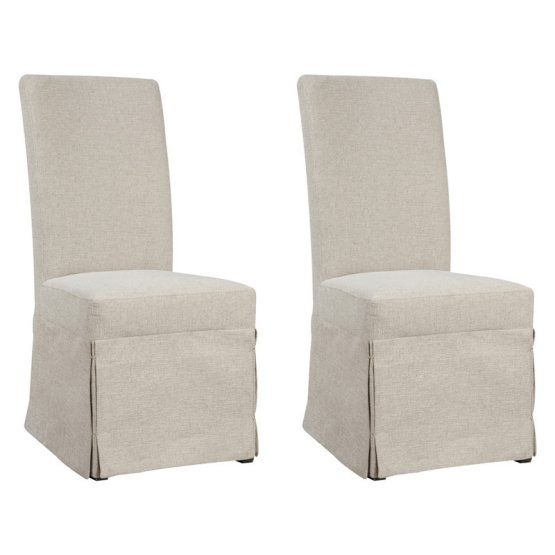 pair of beige upholstered dining chairs