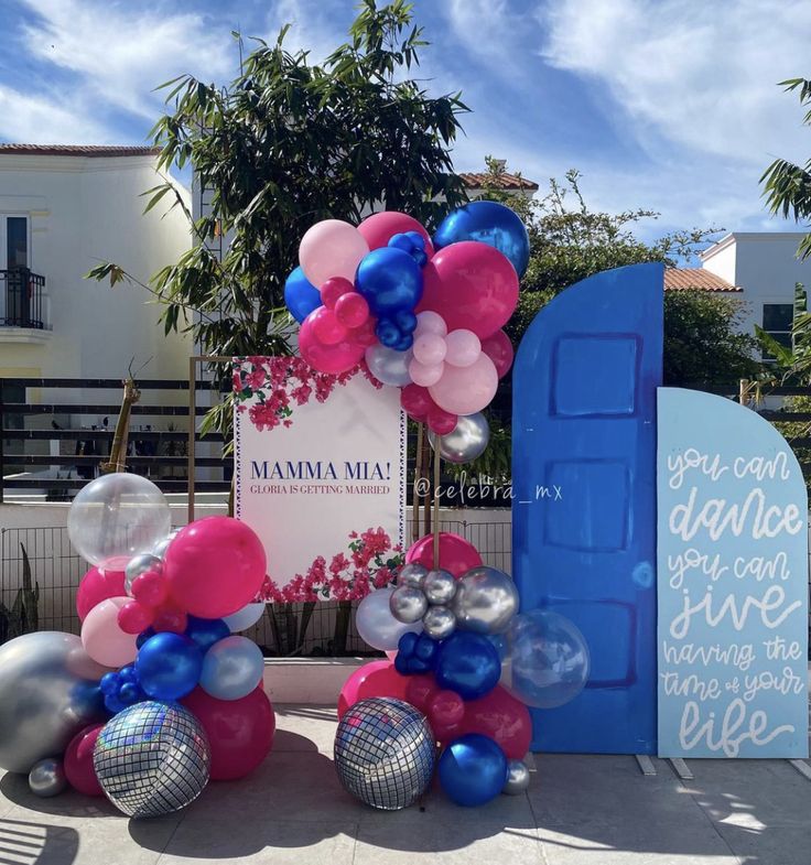 balloons and streamers decorate the entrance to mamma mia's new location in west hollywood