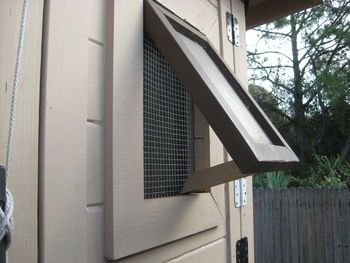 an open window on the side of a house