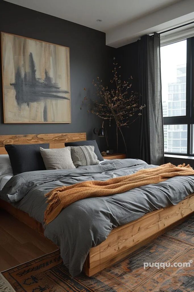 a large bed sitting in a bedroom on top of a wooden floor next to a window