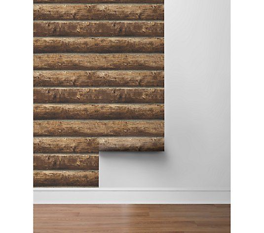 a wall with wooden slats on it and a wood floor in front of it