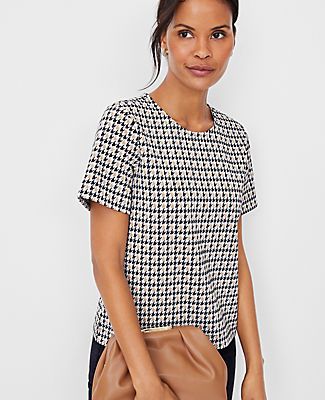 Elevate your wardrobe with the timeless elegance of the Ann Taylor Houndstooth Crew Neck T-Shirt. This piece combines classic style with modern comfort, featuring a sophisticated tan multi houndstooth pattern that's perfect for any occasion.

- Size: 2XS
- Color: Tan Multi
- Gender: Female
- Material: 74% Polyester, 25% Rayon, 1% Spandex
- Fit: Relaxed fit
- Length: 23 1/2" long
- Neckline: Crew neck
- Sleeves: Short sleeves
- Care Instructions: Machine washable

Designed to hit at the hip, this Knitted Suit, Hip Style, Short Sleeve Shirts, Houndstooth Pattern, Pretty Hair, Knit Tees, Crew Neck Tee, Pretty Hairstyles, Effortless Style