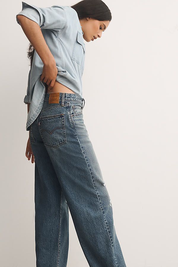 Denim, decoded: This fall, we’re digging denim in every corner of our closet – like the Levi's Baggy Dad Jeans, offering a high-rise, a wide-leg, and a roomy, slouchy fit. | Baggy Dad High-Rise Wide-Leg Jeans by Levi's in Blue, Women's, Size: 29, Cotton at Anthropologie Levi's Wide Leg Denim Flare Jeans, Levi's Wide Leg Jeans For Everyday Wear, Levi's Relaxed Fit Wide Leg Flare Jeans, Levi's Wide Leg Rigid Denim Jeans, Levi's Wide Leg Rigid Denim Bottoms, Levi's Relaxed Fit Wide Leg Jeans, Levi's Wide Leg Medium Wash Jeans, Levi's Casual Wide Leg Flare Jeans, Levi's Casual Wide-leg Flare Jeans