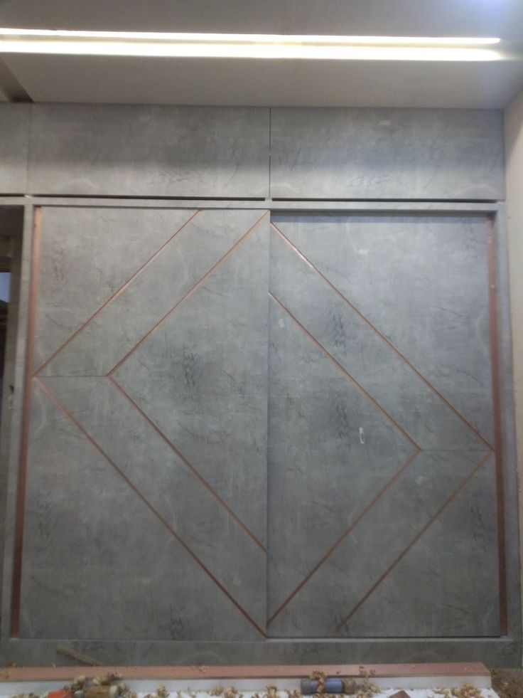 the inside of a building that is being built with concrete and copper foil on it