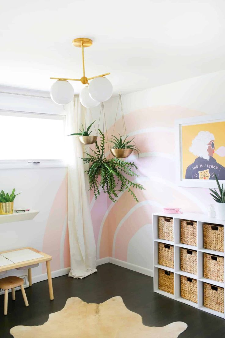 a living room filled with furniture and plants on top of it's shelves in front of a window