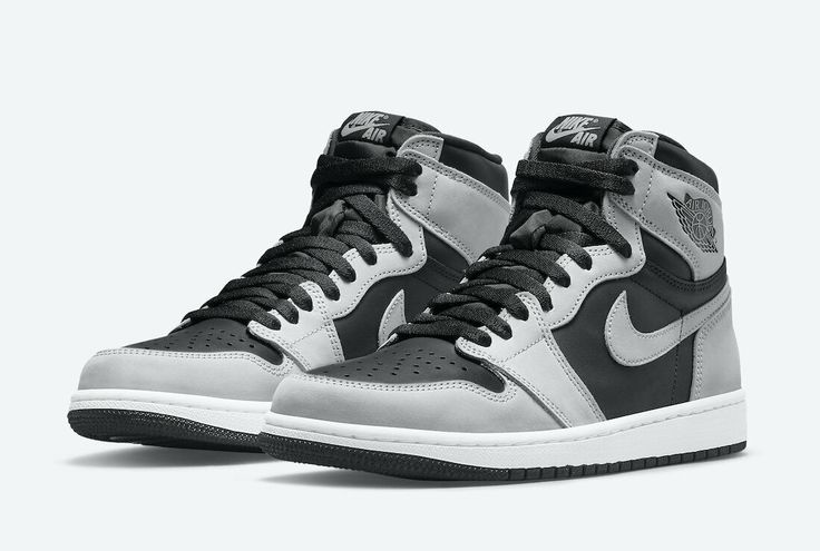 the nike air jordan 1 mid is available in black and white, with grey accents