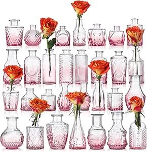 there are many vases with flowers in them