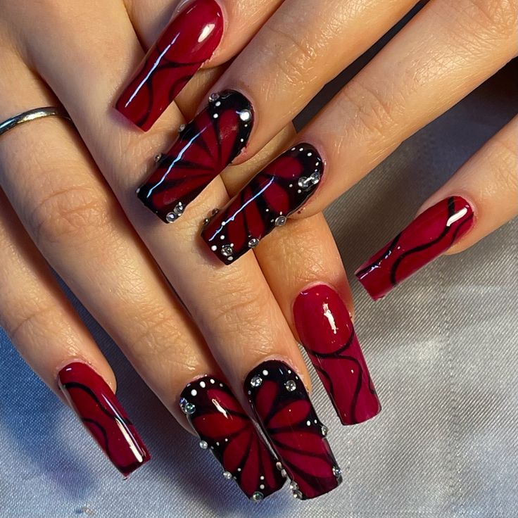 Black And Red Butterfly Nails, Black Nails Alternative, Dark Cherry Red Nails Acrylic Design, Black And Red Nails Ideas Prom, Red Unique Nails, Black And Red Airbrush Nails, Black Acrylic Nail Designs Coffin, Black And Red Nail Designs Acrylics, Red And Black Coffin Nail Ideas