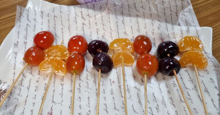 several lollipops are lined up on a sheet of paper