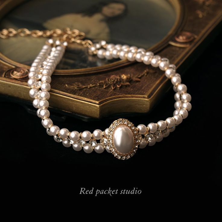 It is a perfect accessory for weddings, formal occasions, or any event where you want to make a statement. This sophisticated choker is designed to showcase your elegance and charm. Features: Material: Artificial pearls and alloy Chain style: Round pearl chain Length: 33cm + 11cm adjustable Weight: 38g Multi-layered with a pendant Pendant Material: Alloy Circumference: 21cm (inclusive) - 50cm (inclusive) With its vintage pearl design and delicate craftsmanship, this unique choker exudes a timele Luxury Vintage Necklace Collection, Luxury Victorian Chain Necklace As Gift, Luxury Temple Jewelry Wedding Choker, Luxury Antique Pearl Chain Necklaces, Luxury Victorian Antique Finish Necklace, Luxury Elegant Pearl Necklace For Layering, Luxury Traditional Necklaces With Historical Design, Luxury White Elegant Kundan Necklace, Luxury Jewelry With Historical Baroque Design