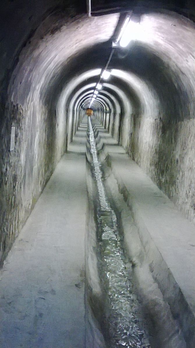 an underground tunnel with water running through it