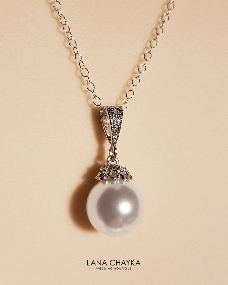 Wedding Swarovski 10mm White Pearl Drop 925 Sterling Silver Chain CZ Bridal Necklace. Classy and elegant, this necklace would be great for any wedding! CHAIN is 18 inches (45.7 cm) long. PENDANT is about 0.86 inch (2.2cm) long including bail. MATCHING EARRINGS: https://www.etsy.com/listing/99757178/bridal-white-drop-pearl-earrings?ref=shop_home_active_14 Handmade necklace, is made with .925 Sterling Silver 18 inches cable chain, Swarovski 10mm White round crystal pearl, Rhodium Sterling Silver p Wedding Jewelry With Pearl And Diamond Accents, Pearl Necklace With Diamond Accents For Wedding, Elegant Pearl Pendant Necklace For Wedding, Wedding Pearl Necklace With Diamond Accents, Elegant Pendant Pearl Necklace For Wedding, Elegant Silver Bridal Necklace For Wedding, Elegant Silver Bridal Necklace, Elegant Wedding Pearl Pendant Necklace, Elegant White Pendant Jewelry