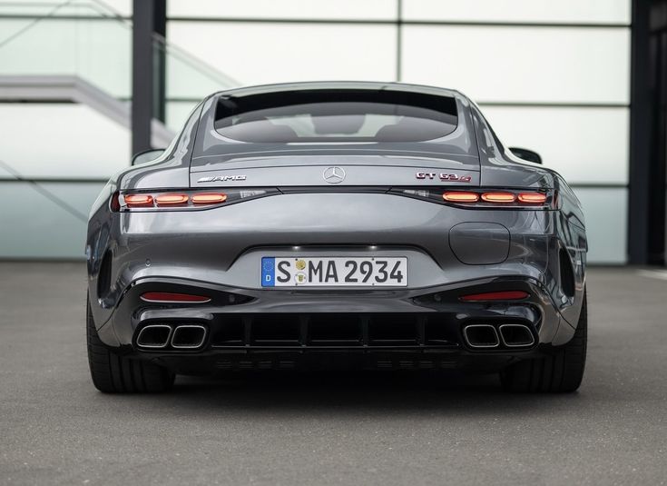 the rear end of a silver sports car