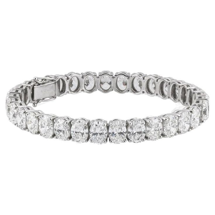 This exquisite bracelet made by Antinori di Sanpietro ROMA features oval cut diamonds weighing an astounding 19 carats total. All stones are very white and perfectly matched. A very elegant and timeless piece. Color of the diamonds is D-F clarity is SI1 with high brilliance. Bracelet Tennis, Oval Cut Diamond, Fine Jewels, Tennis Bracelet, Oval Cut, Timeless Pieces, Bracelet Making, Diamond Bracelet, Jewelry Bracelets