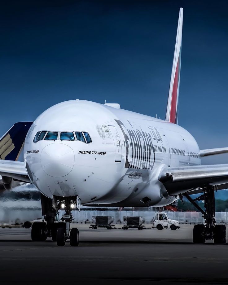 a large jetliner sitting on top of an airport tarmac