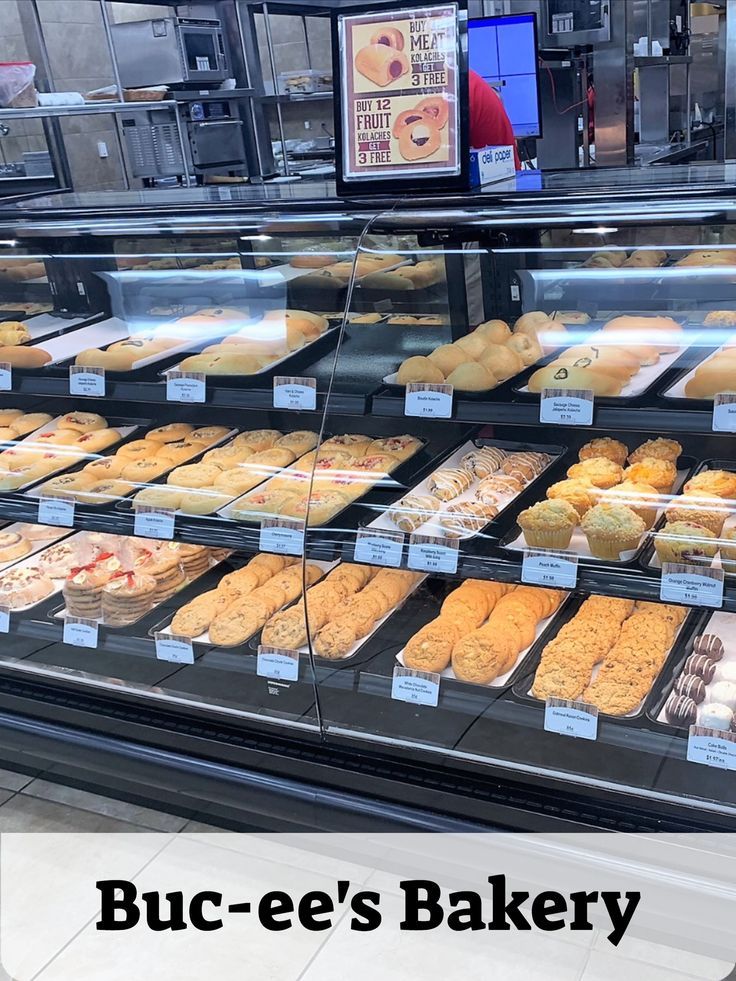 a display case filled with lots of different types of doughnuts and pastries