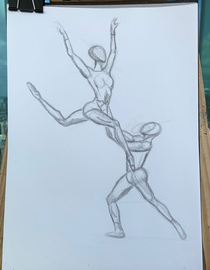 a drawing of two people standing next to each other on top of a piece of paper