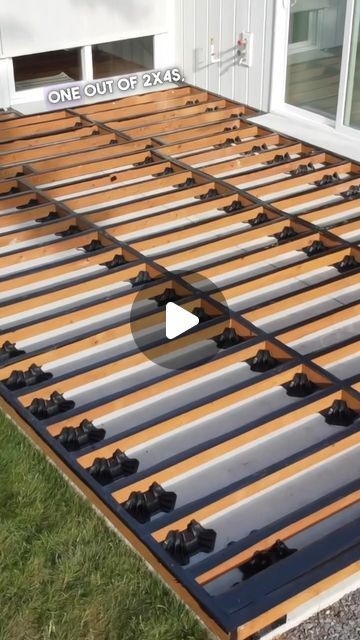 an image of a roof being constructed with metal sheets and wood slats on the ground