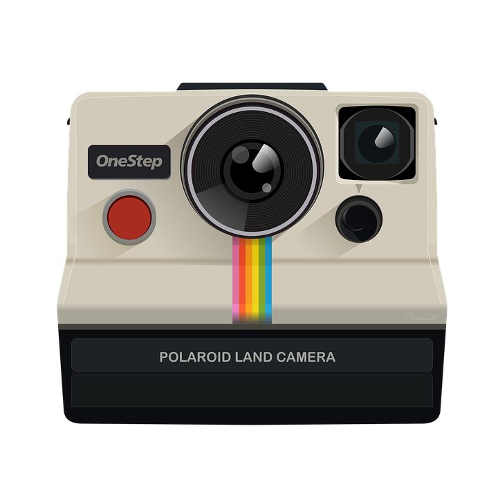 the polaroid land camera is white and has a rainbow - colored stripe on it