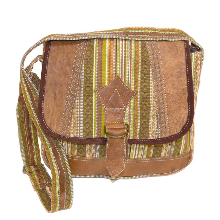 Aza Buffalo Leather & Cotton Bag Nepali bag made with woven cotton and buffalo leather. Each bag's material is cut and applied differently for a one-of-a-kind statement piece. Cotton fabric Superior stitching to ensure years of use Long adjustable shoulder strap One internal pocket with zip close Like this bag? Check out the rest of our bag collection! Green Leather Trim Crossbody Shoulder Bag, Casual Handwoven Leather Bag, Beige Leather Trim Flap Shoulder Bag, Beige Flap Shoulder Bag With Leather Trim, Woven Leather Bags For Everyday Use, Everyday Leather Woven Bag, Natural Leather Trim Shoulder Bag For Travel, Artisan Satchel With Adjustable Strap Crossbody, Artisan Crossbody Shoulder Bag With Adjustable Strap