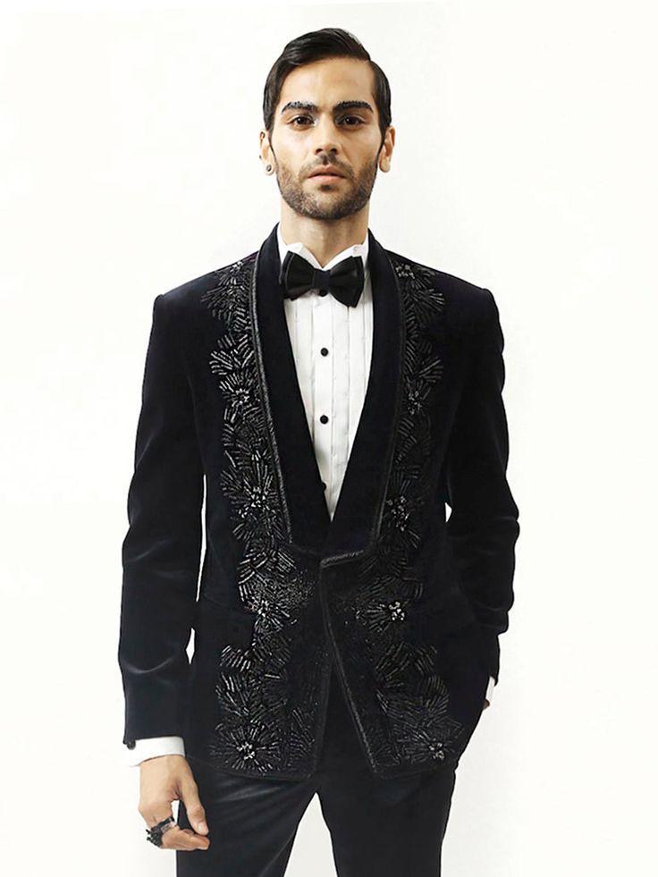 Astrum handcrafted tuxedo is highlighted with metallic threads. Single-buttoned satin detail shawl collar. This creation in velvet can be tempered with flat-front trousers for a reception look. Embroidered Tuxedo, Reception Look, Metallic Thread, Shawl Collar, Hand Embroidered, Shawl, Trousers, Velvet, Satin