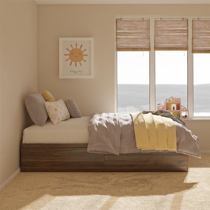 a bed sitting in a bedroom next to two windows with blinds on each side of it