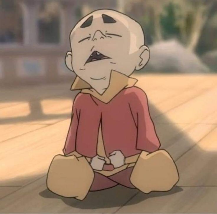 a cartoon character sitting on the ground with his eyes closed