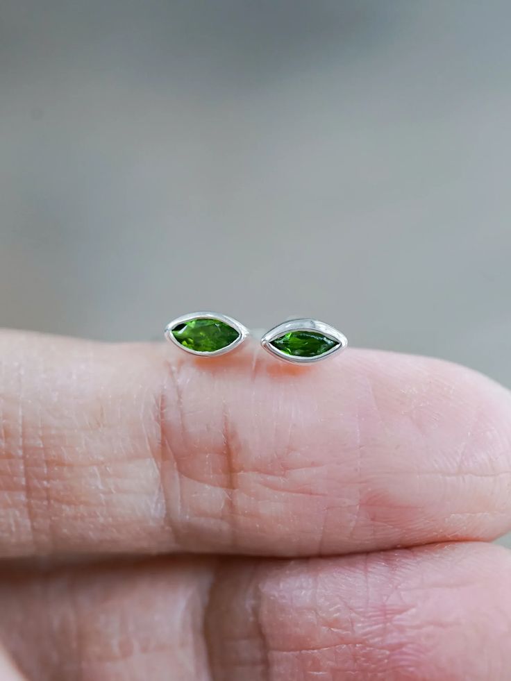 These chrome diopside studs are a perfect addition to your jewelry collection. Deep green marquise diopside lends an earthy vibe to these stud earrings, held in a bezel setting for a sophisticated look. These green gemstone studs are perfect for the office or even for a night out. Gift Sterling Silver Marquise Cut Earrings, Green Marquise Sterling Silver Jewelry, Green Garnet, Mismatched Earrings, Ethical Jewelry, Raw Diamond, Gemstone Studs, Recycled Silver, Green Earrings