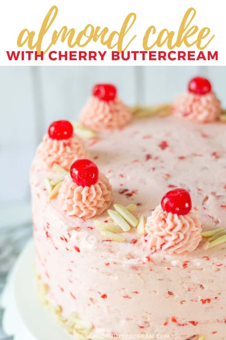 an almond cake with cherry buttercream frosting and cherries on the top