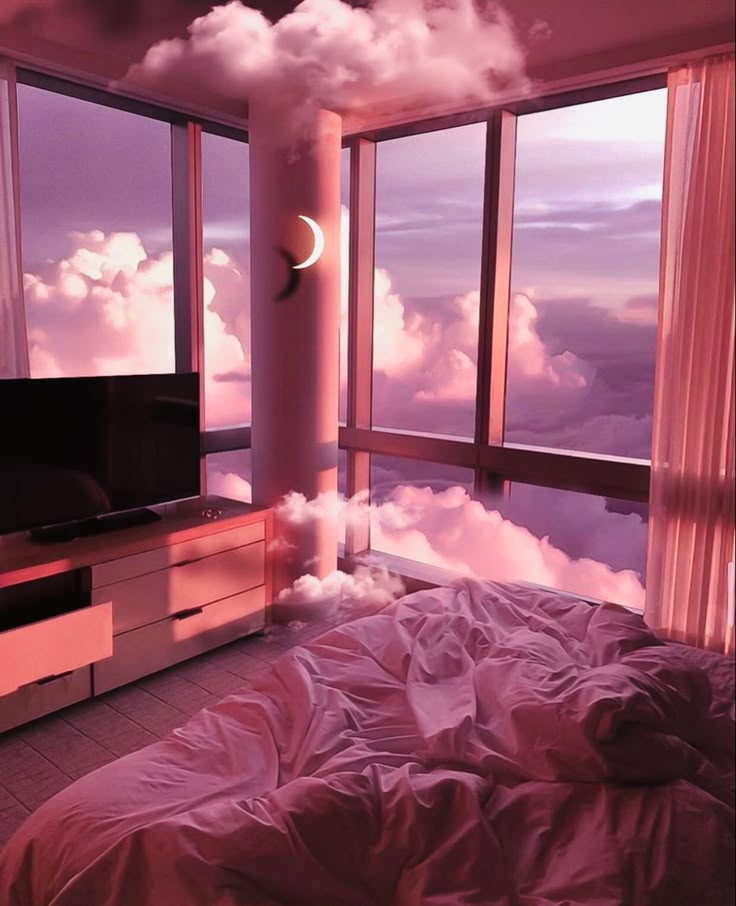 a bed room with a large window and a tv on top of the dressers